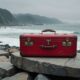 red suitcase crosses ocean